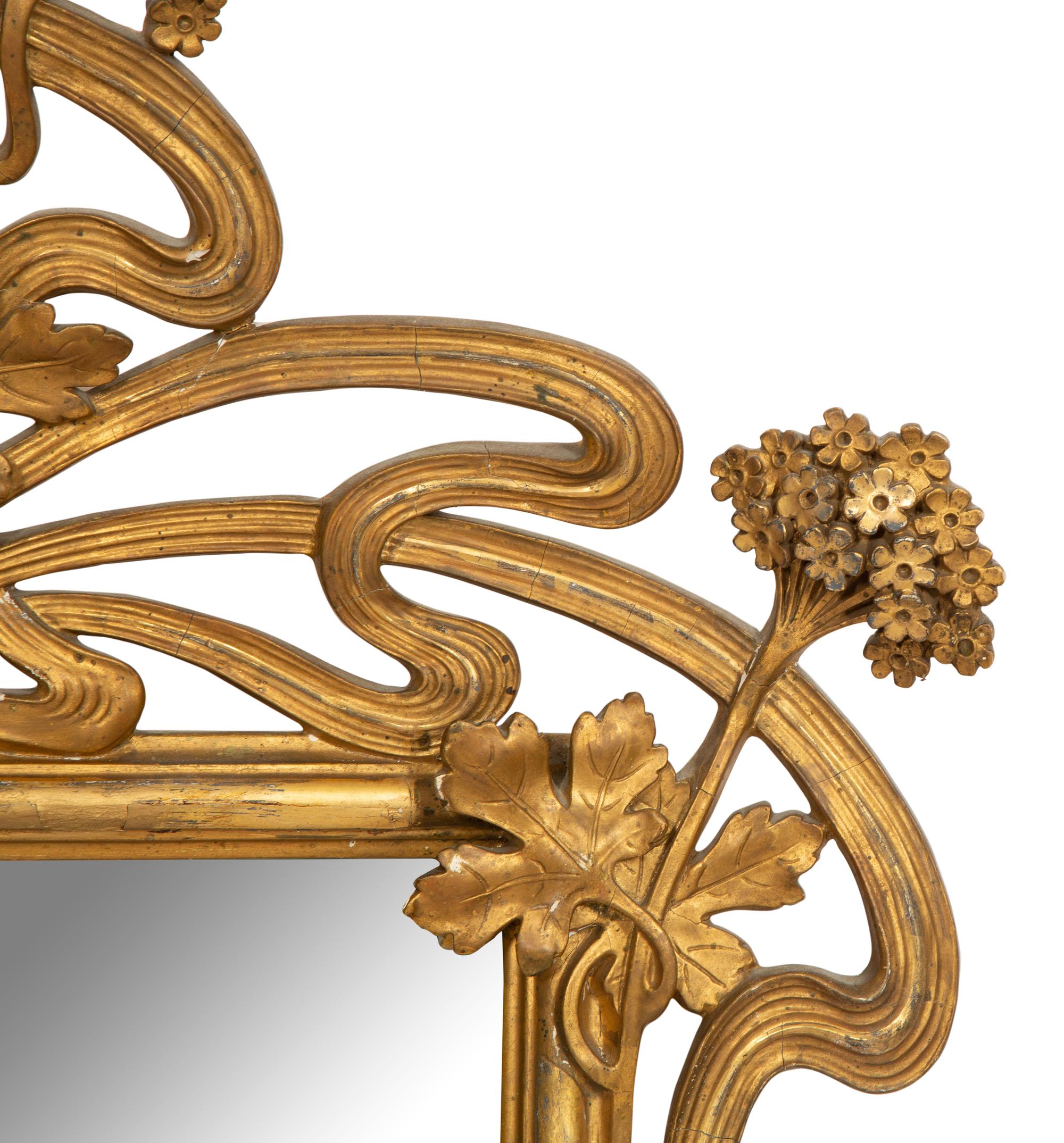 A Continental Art Nouveau Giltwood Mirror
