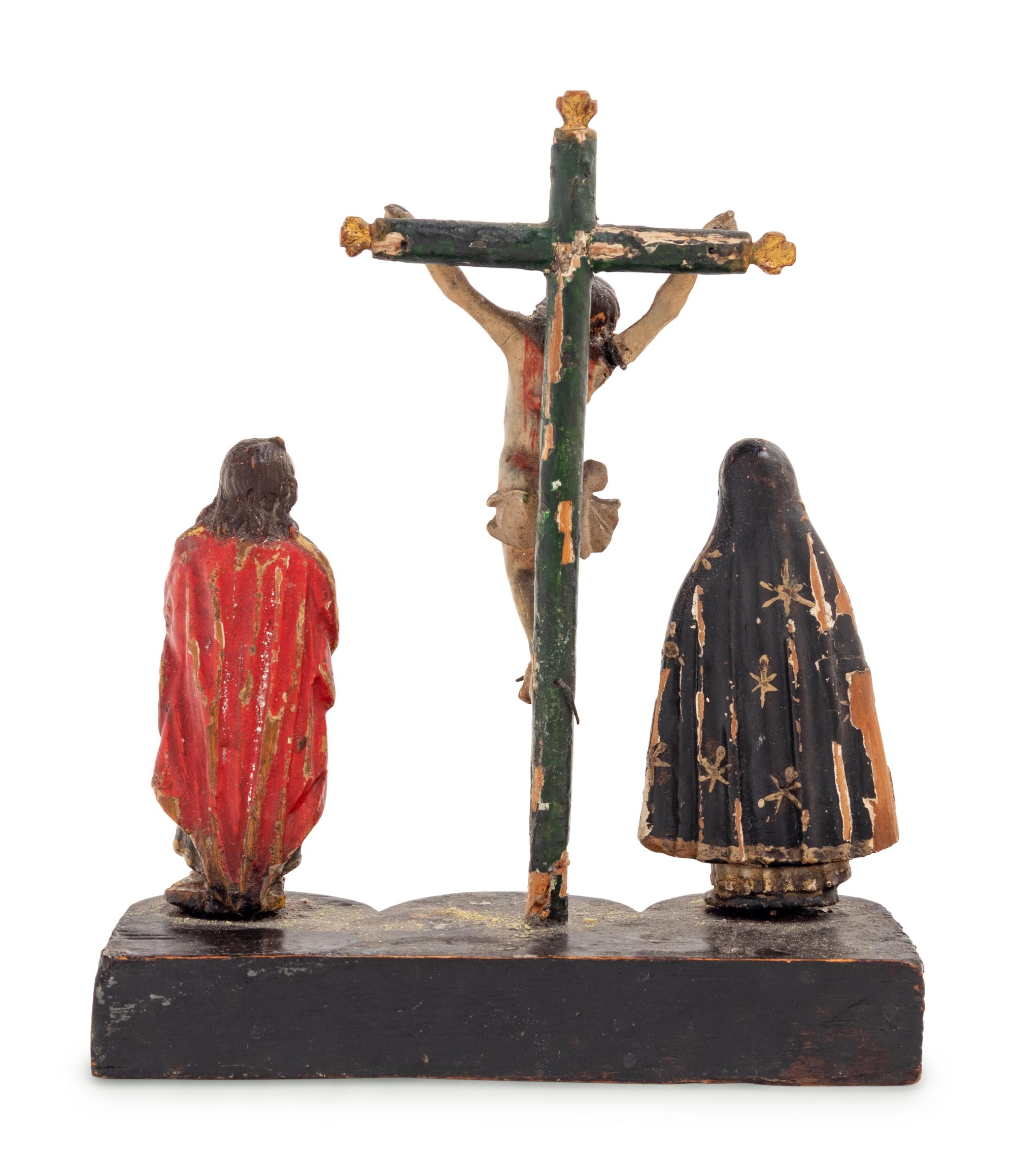 A Continental Carved and Polychrome Decorated Figural Group Depicting the Crucifixion
