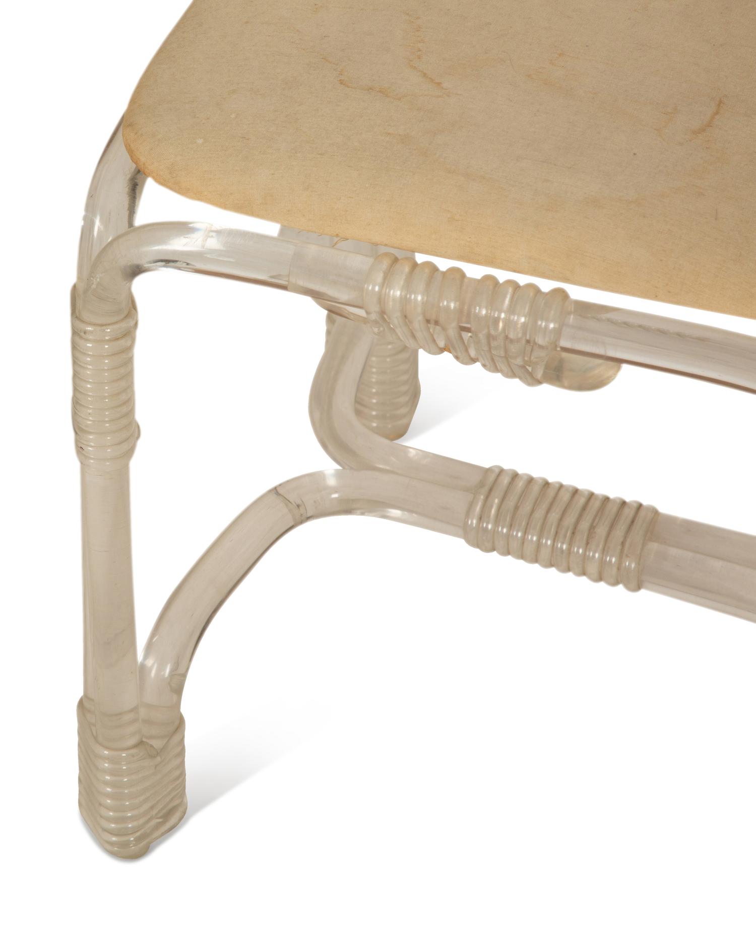 A Pair of Tubular Acrylic Low Back Chairs