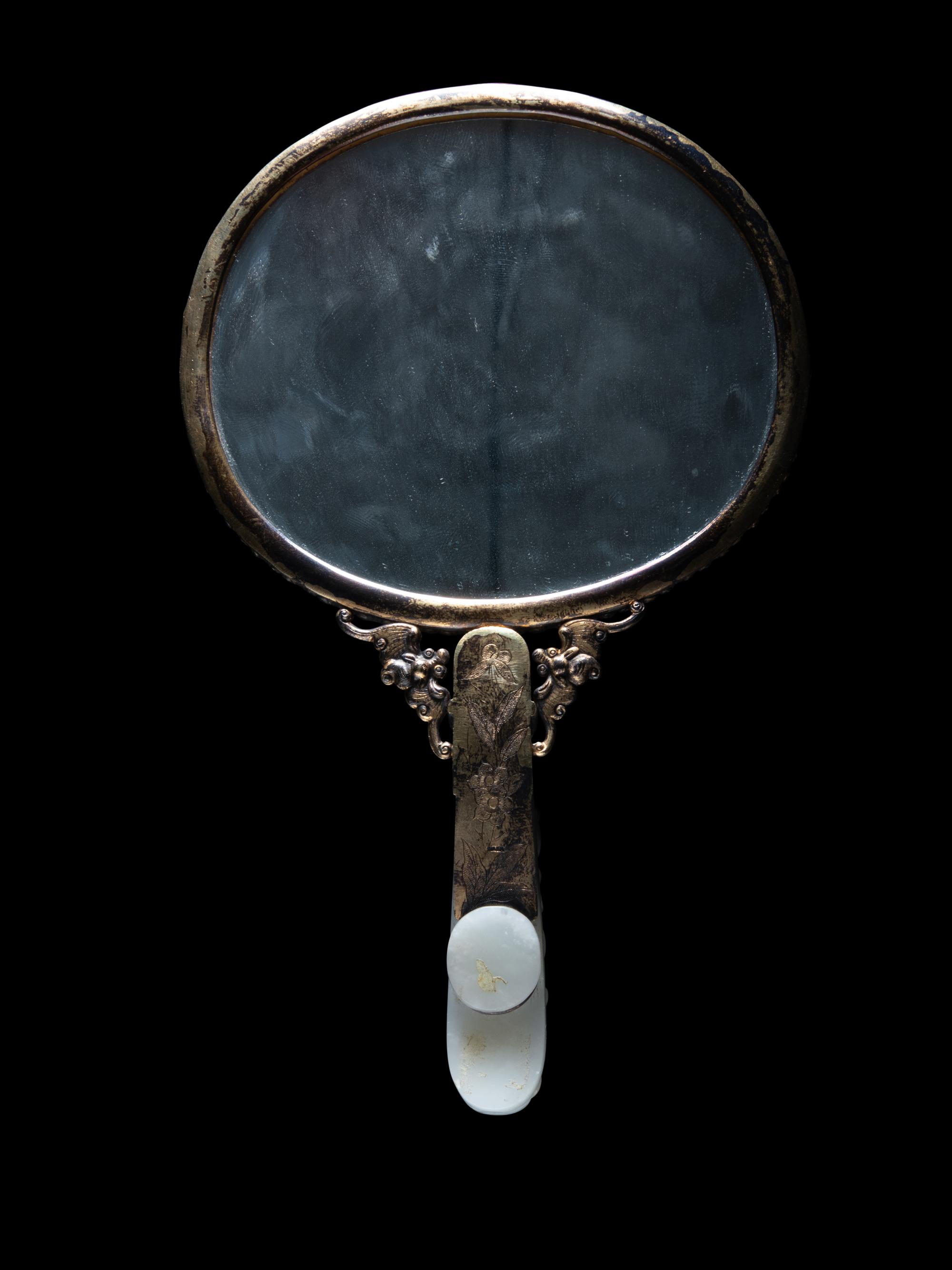 A White Jade Mounted and Hardstone Embellished Hand Mirror