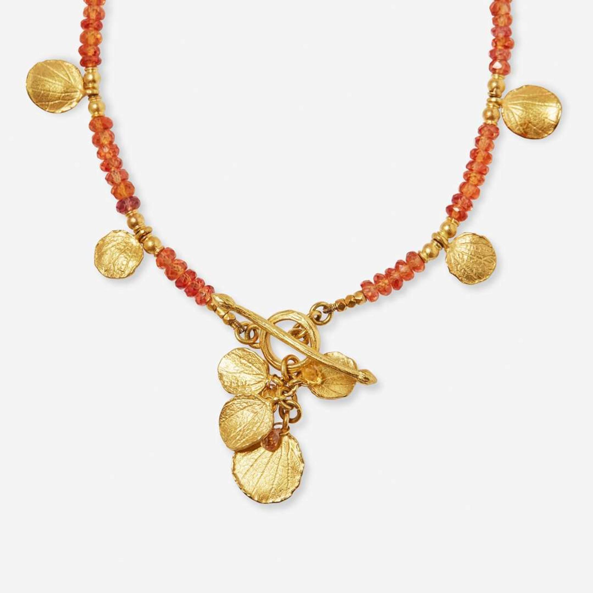 An 18K Yellow Gold Ring and Necklace