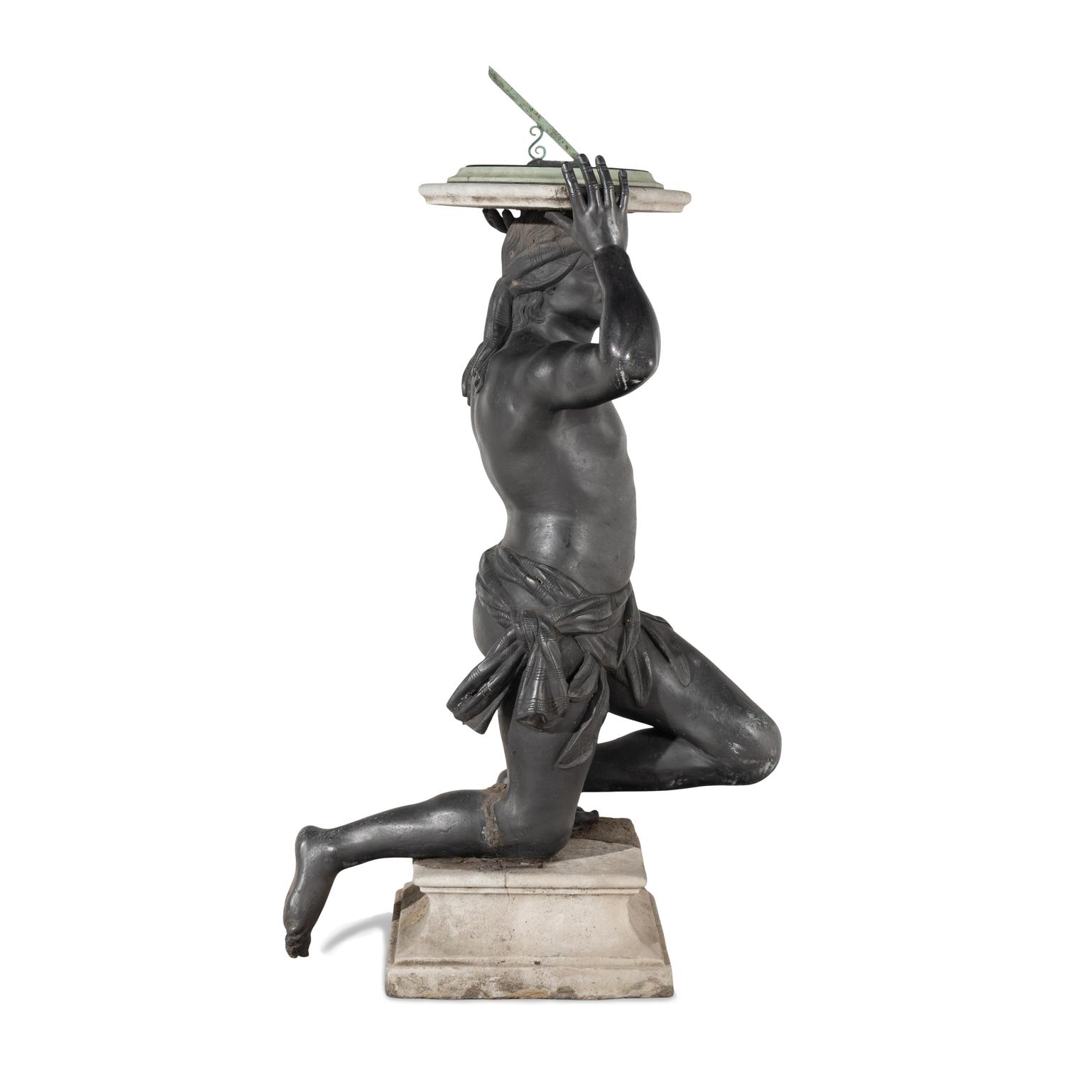 A Cast Lead Figural Sundial