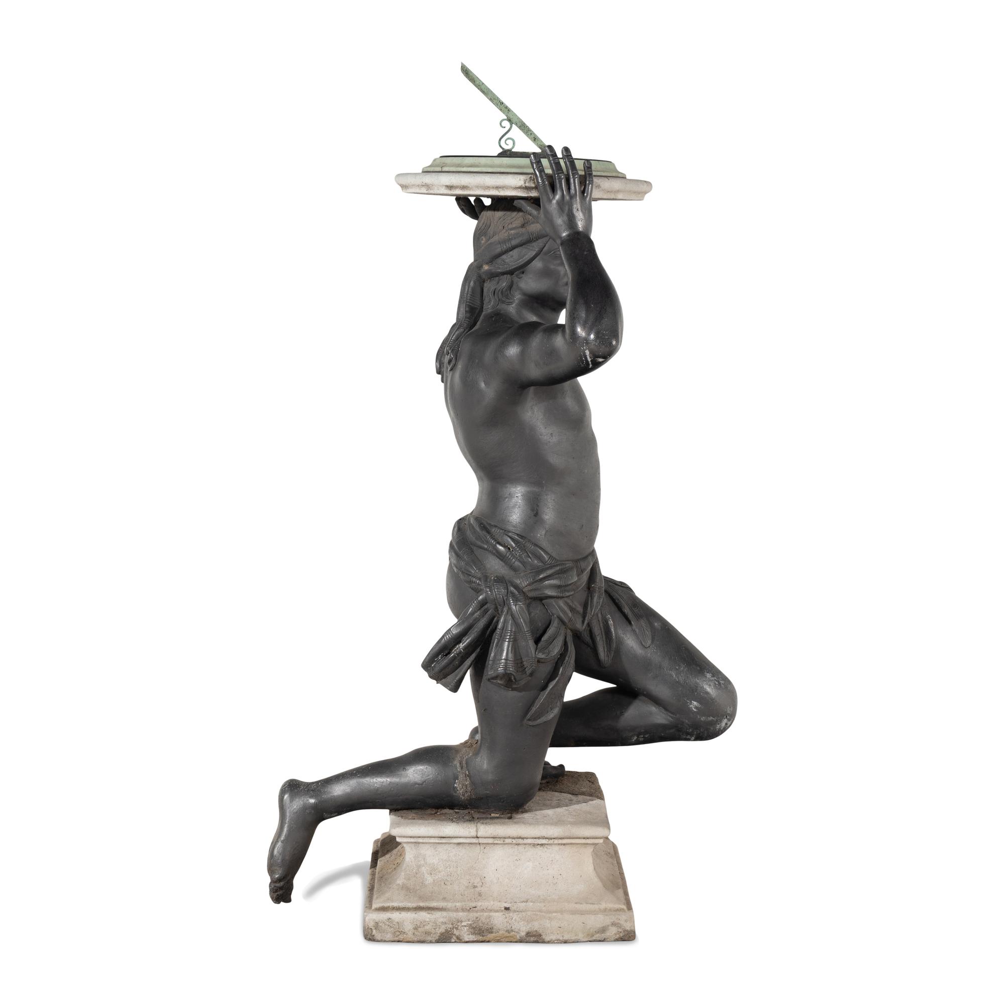 A Cast Lead Figural Sundial