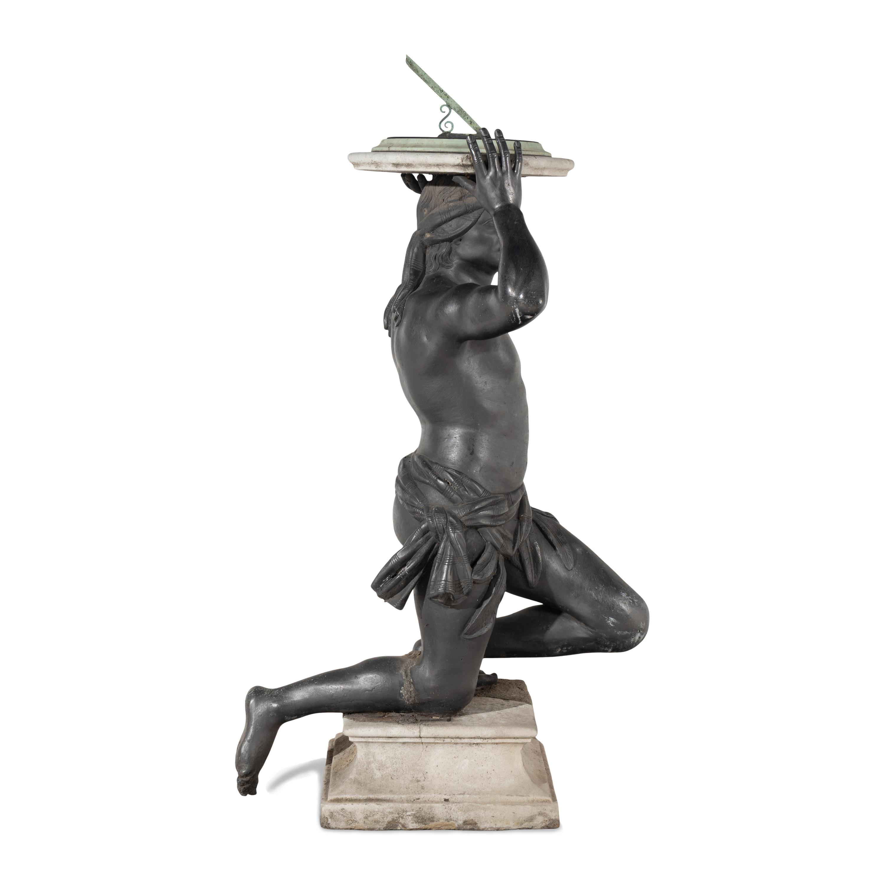 A Cast Lead Figural Sundial