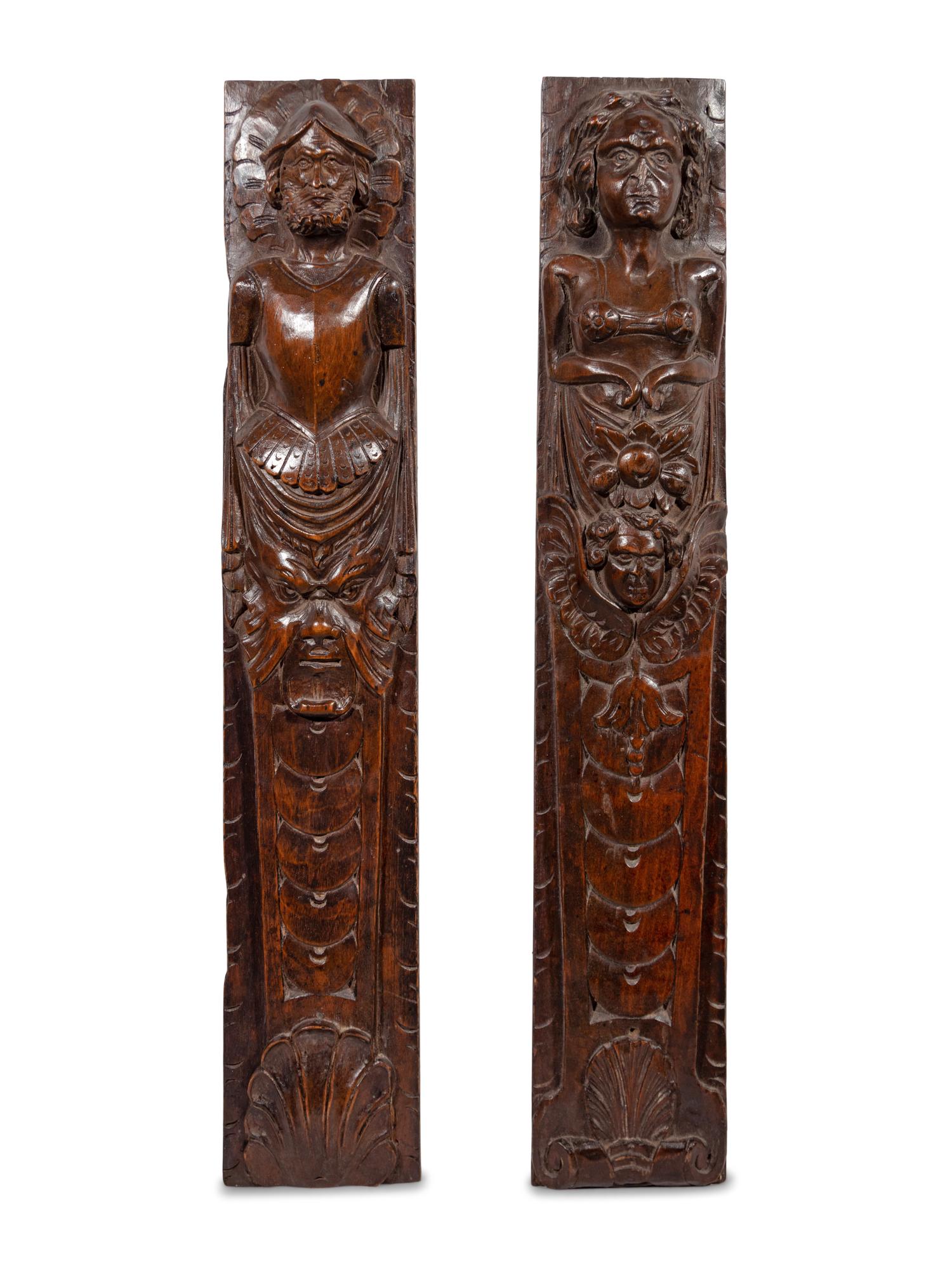 A Pair of Continental Carved Figural Pilasters