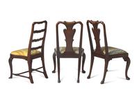 A Group of Three George II Carved and Veneered Walnut and Elm Side Chairs