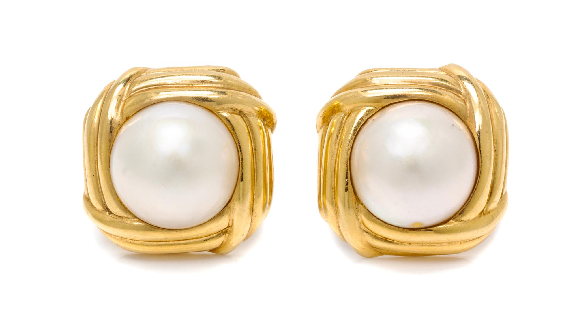 A Pair of 18 Karat Yellow Gold and Mabe Pearl Earclips, 13.30 dwts.