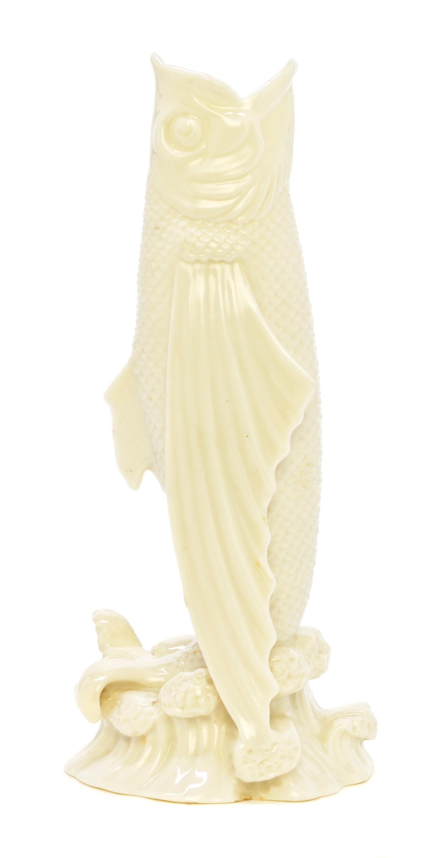 A Belleek Fish Spill Vase, Height 7 3/8 inches.