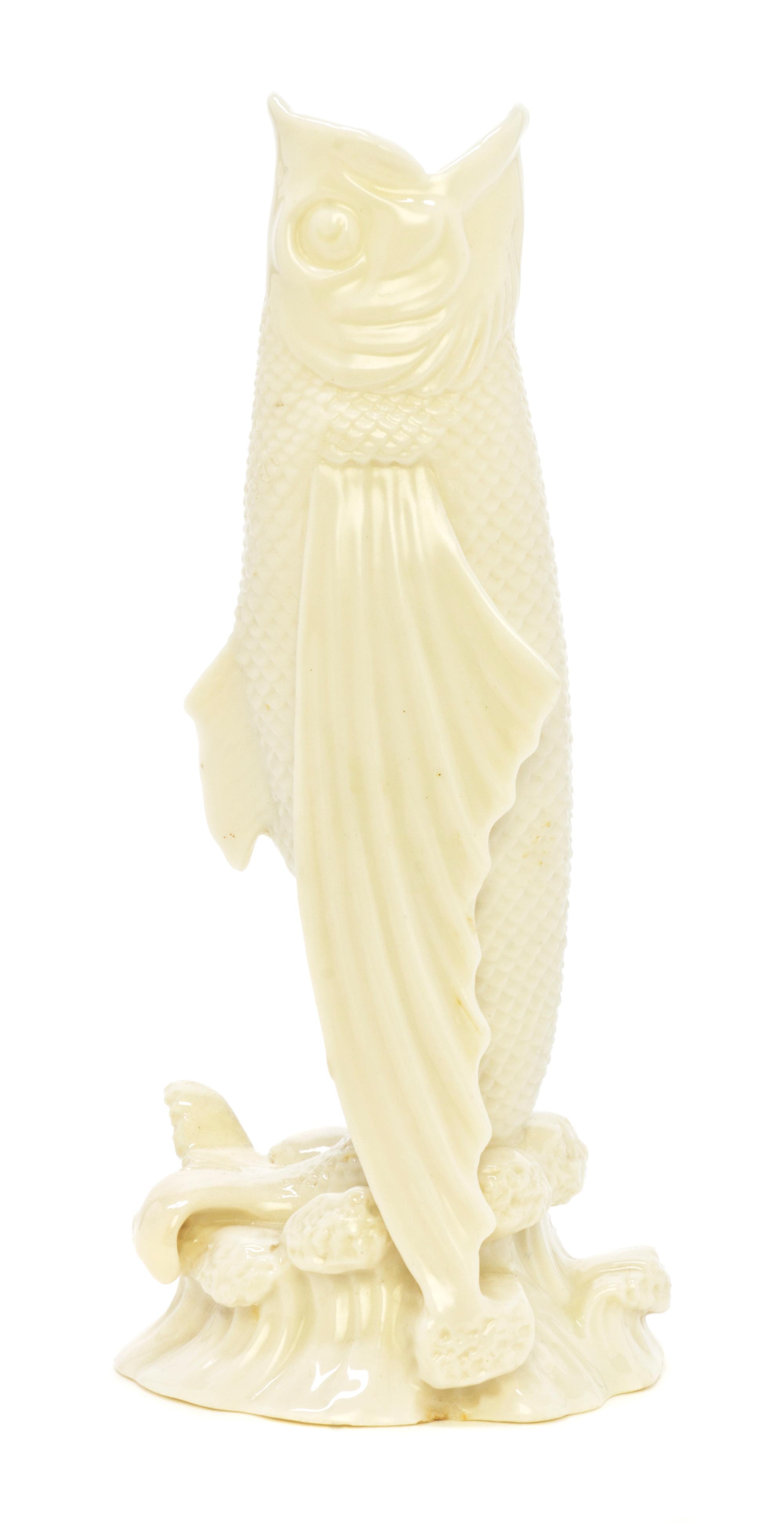 A Belleek Fish Spill Vase, Height 7 3/8 inches.