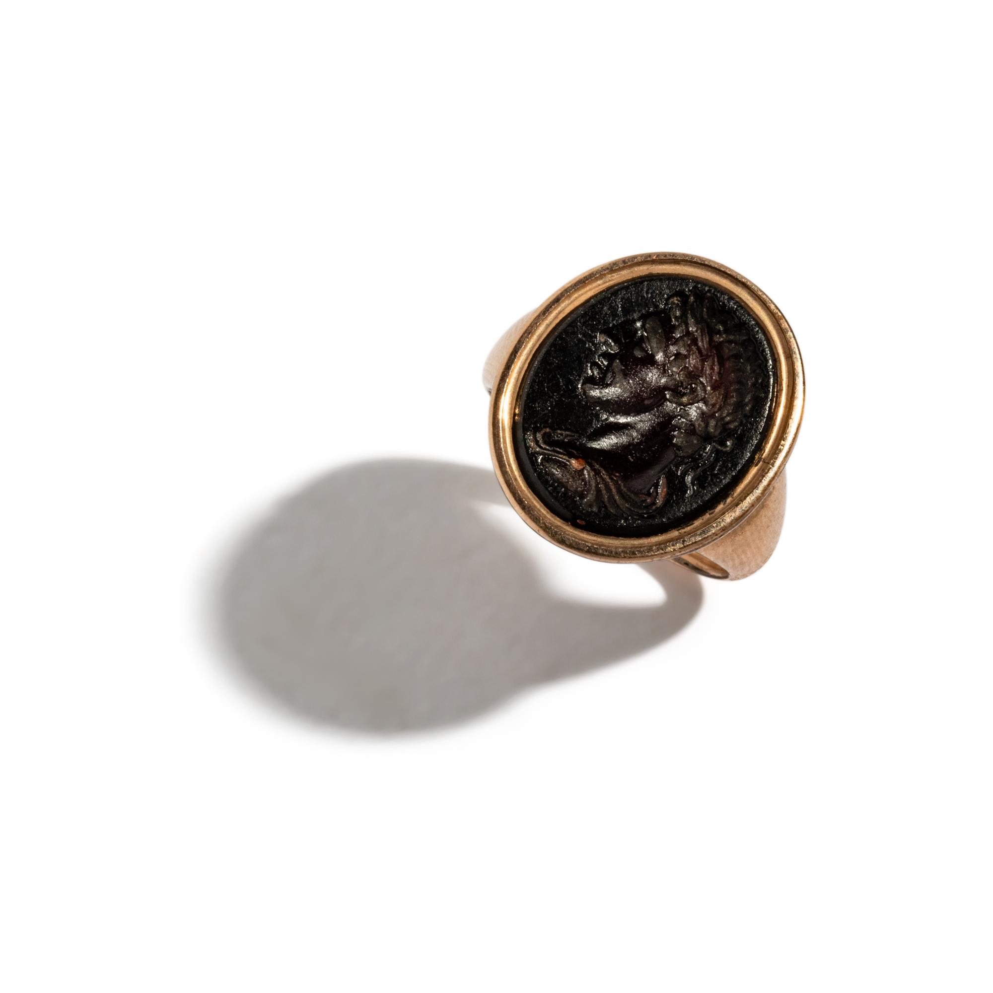 A Neoclassical Gold and Glass Finger Ring with a Portrait Head of a Roman Emperor