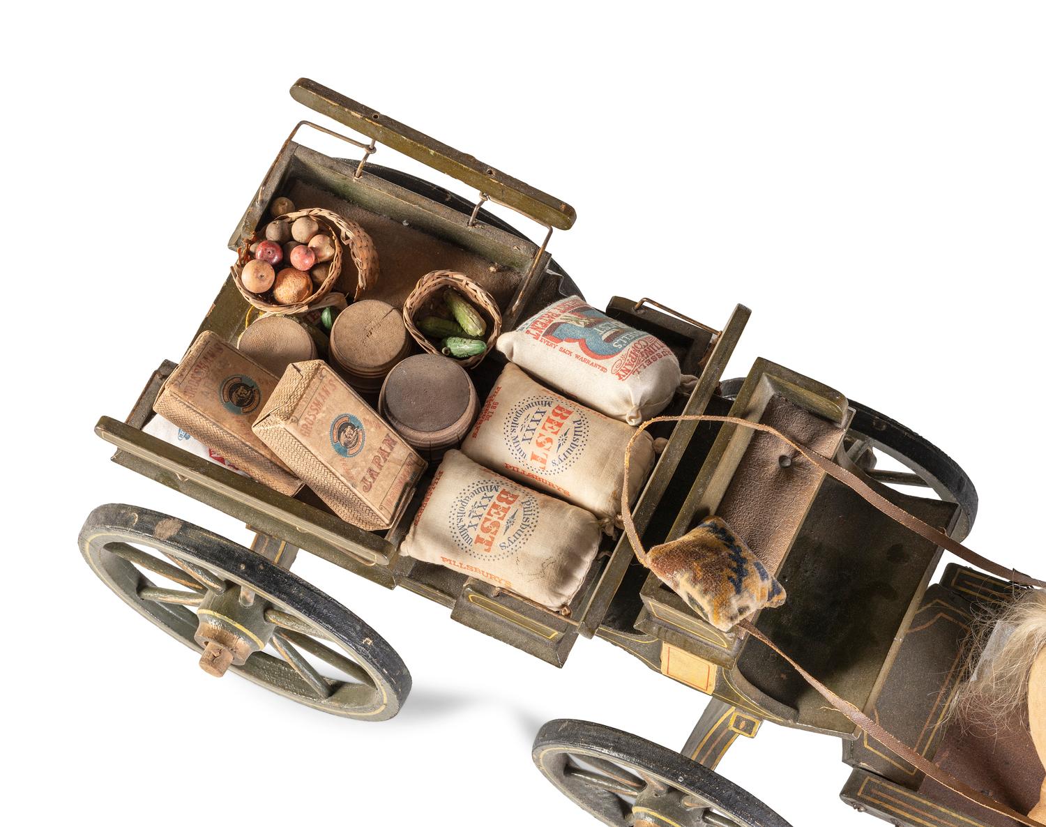 A Carved and Painted Wood Wagon with Stuffed Horse Pull Toy