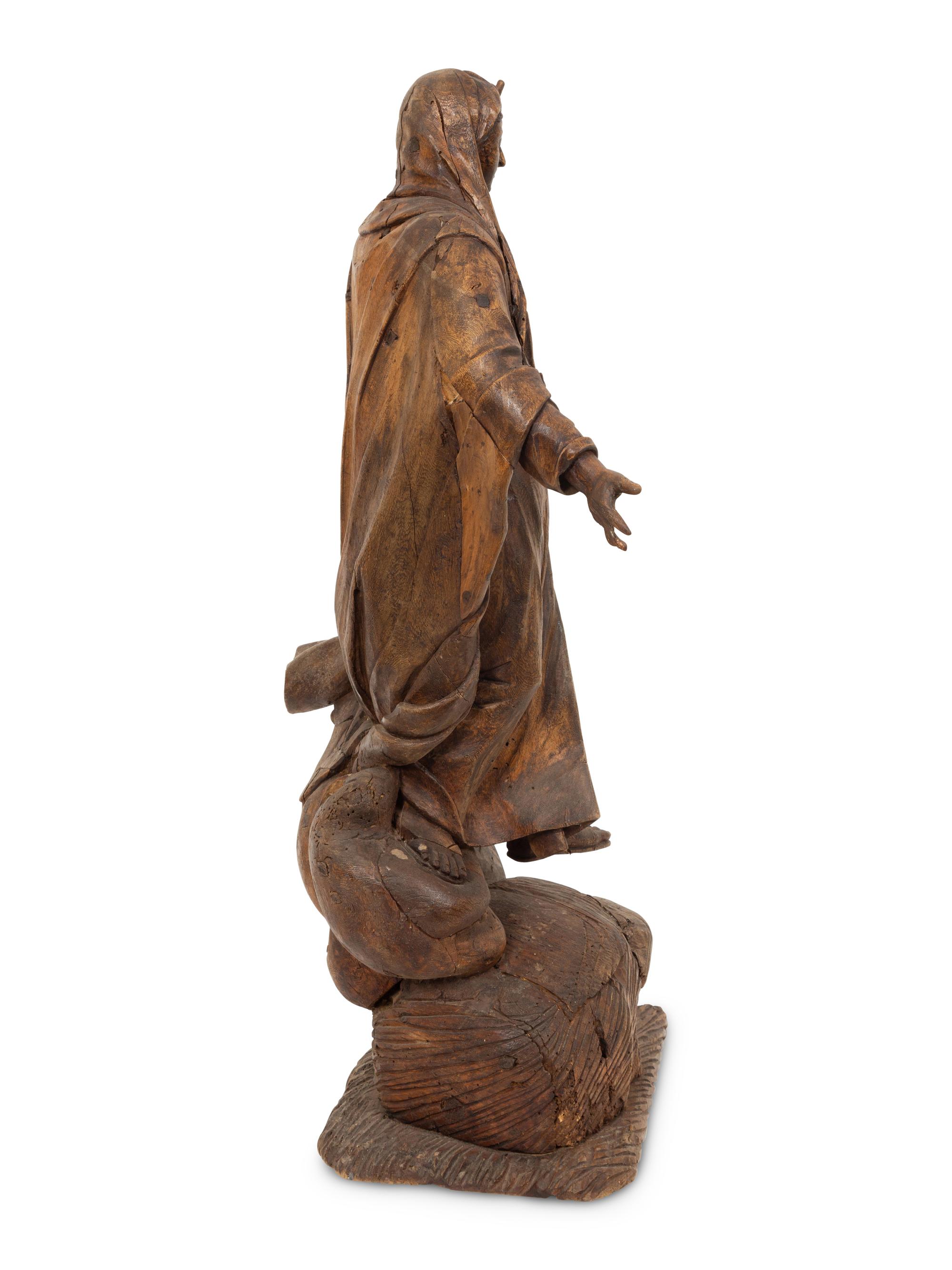 A Continental Carved Pine Figure of Female Saint