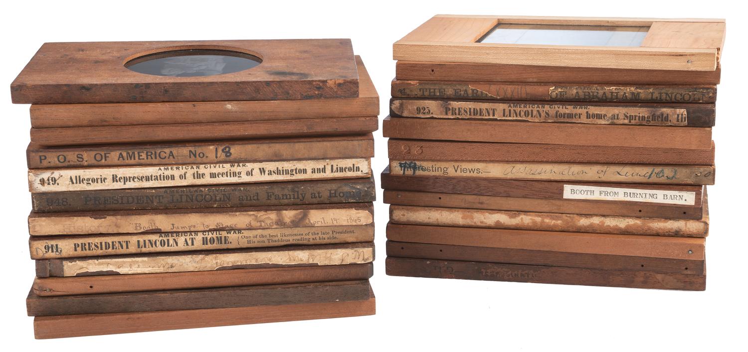 [LINCOLNIANA - MAGIC LANTERN SLIDES]. A collection of 65 assorted glass slides depicting important subjects and scenes depicting the life, death, and legacy of Abraham Lincoln, including: