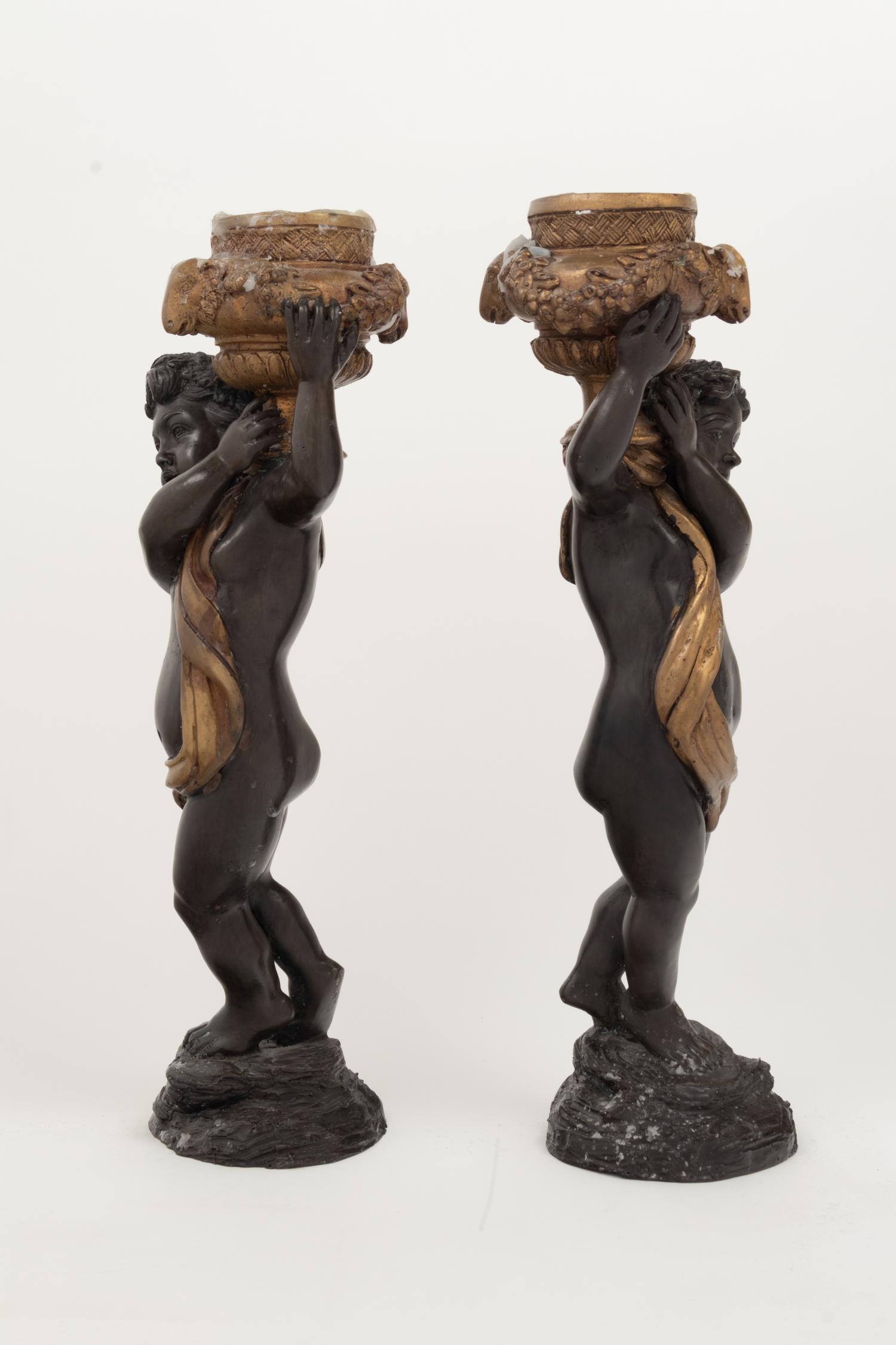 A Pair of Gilt and Patinated Bronze Figures of Cherubs
