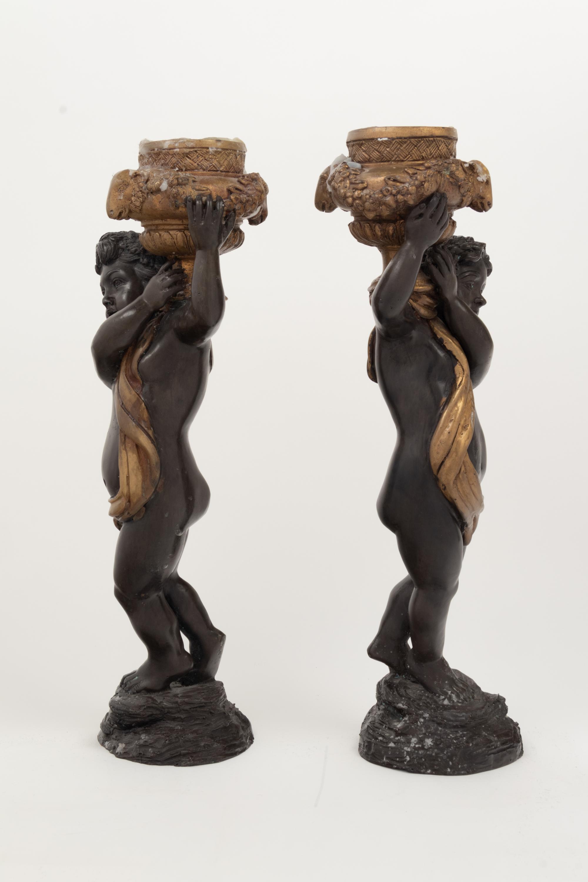 A Pair of Gilt and Patinated Bronze Figures of Cherubs