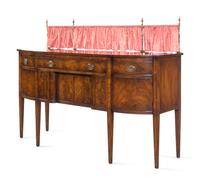 A Regency Style Mahogany Sideboard with Silk Drape on a Brass Gallery