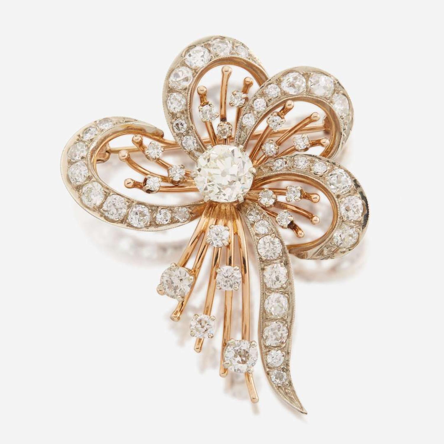A diamond and bicolor gold brooch
