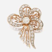 A diamond and bicolor gold brooch