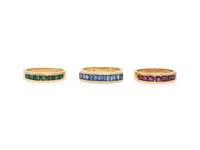 COLLECTION OF THREE RUBY, EMERALD, SAPPHIRE, AND YELLOW GOLD RINGS