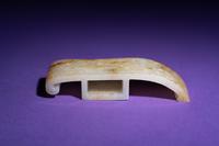 A Chinese White and Russet Jade Sword Slide, Jianzhi