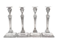 A Set of Four Silver-Plate Candlesticks