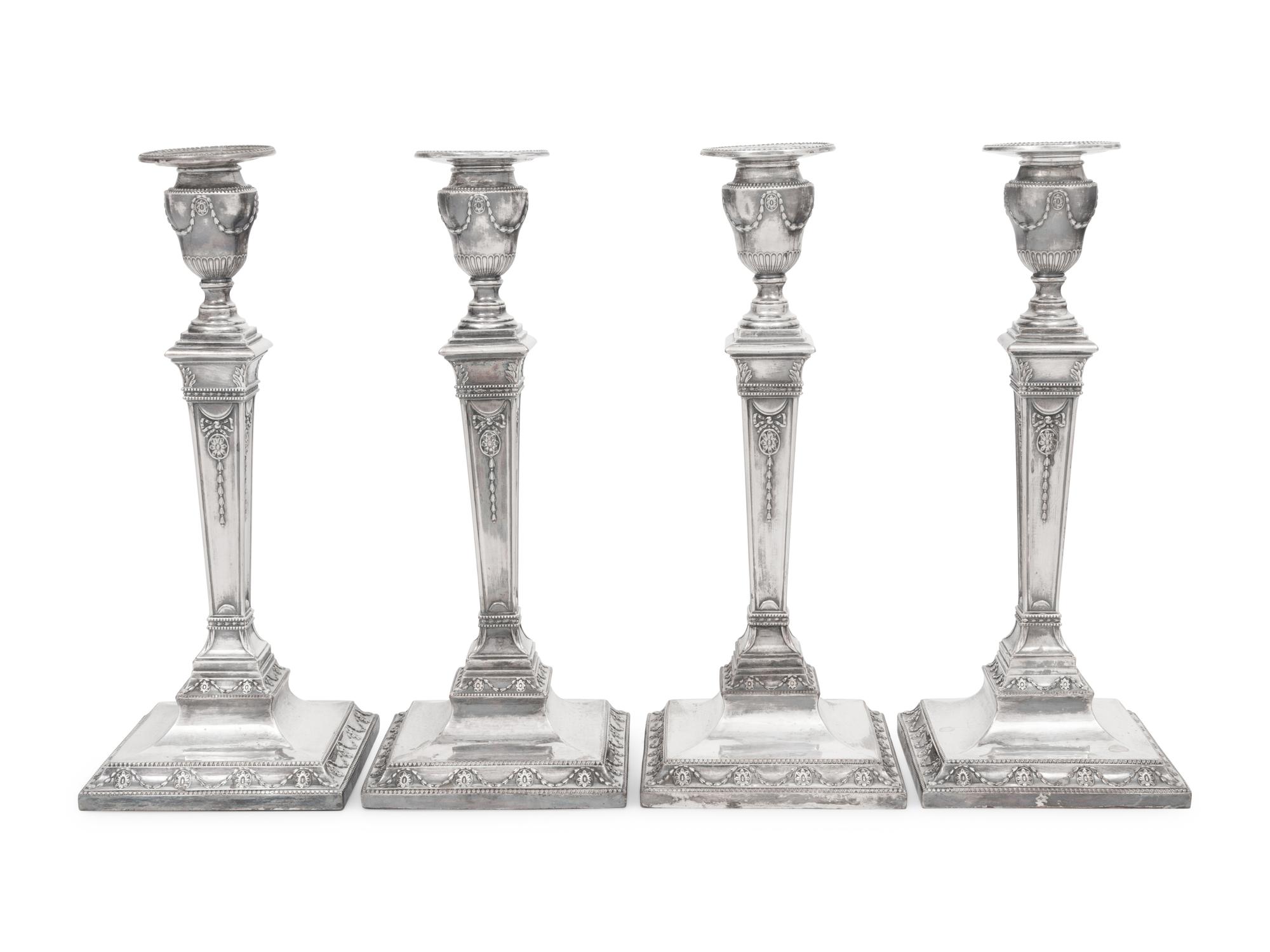 A Set of Four Silver-Plate Candlesticks