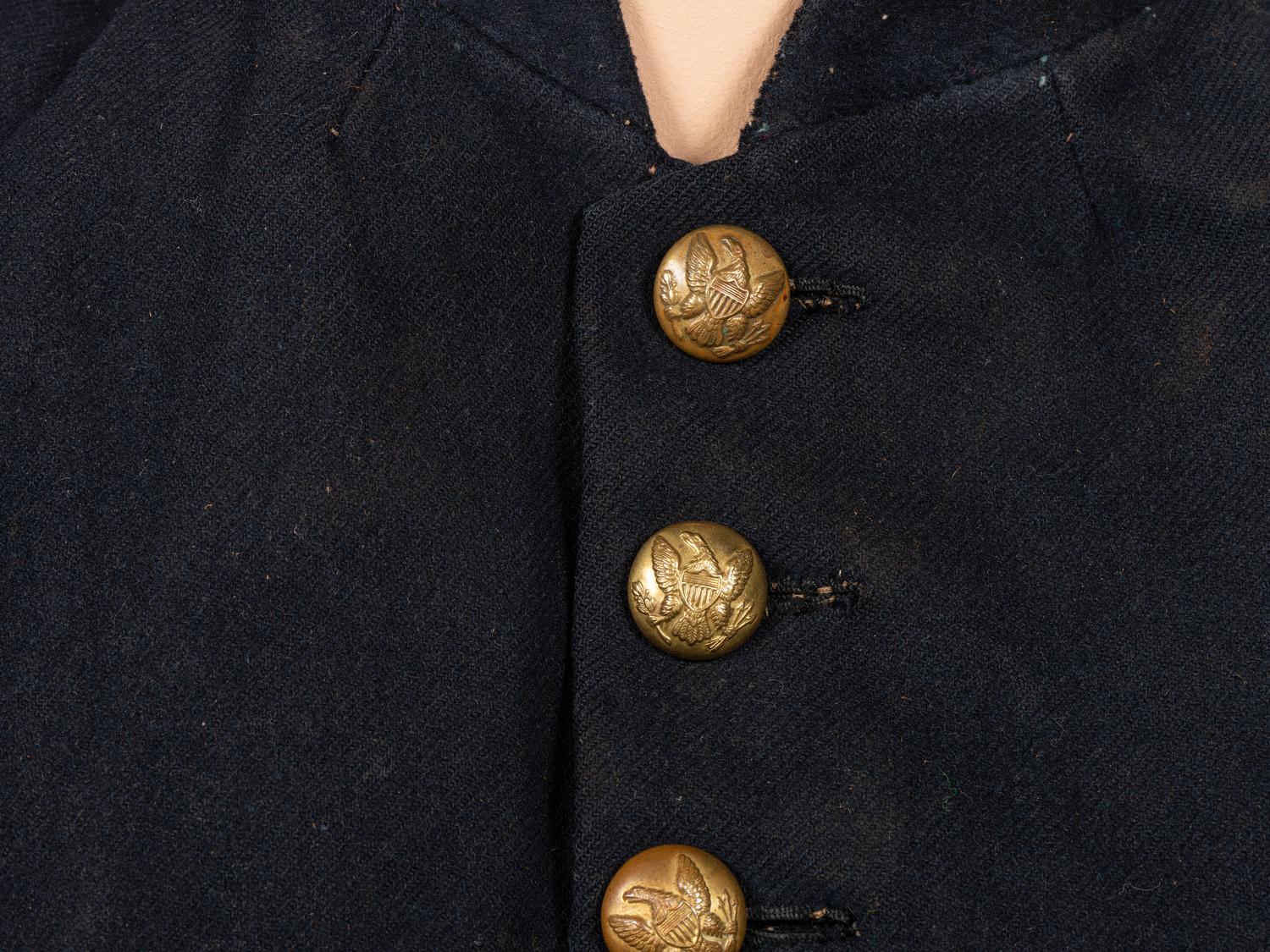 [CIVIL WAR]. A collection of items attributed to Thomas W. Johnson, Co. K, 4th Delaware Infantry, incl. frock coat, cap, belt rig, and cartridge box.