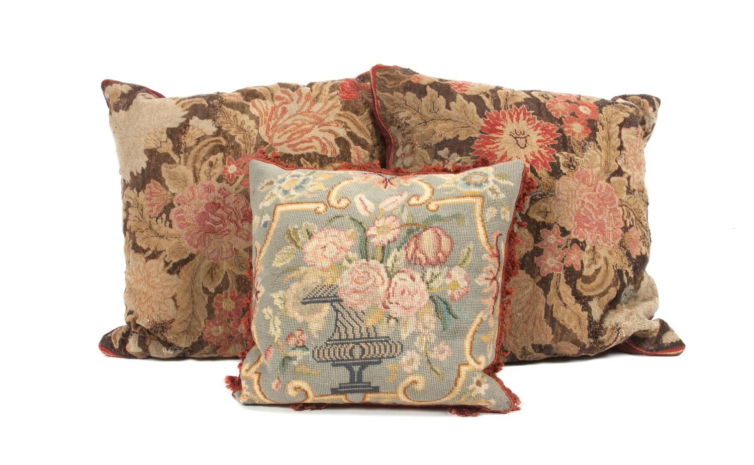 A Collection of Three Needlepoint Pillows Height of largest 19 inches.