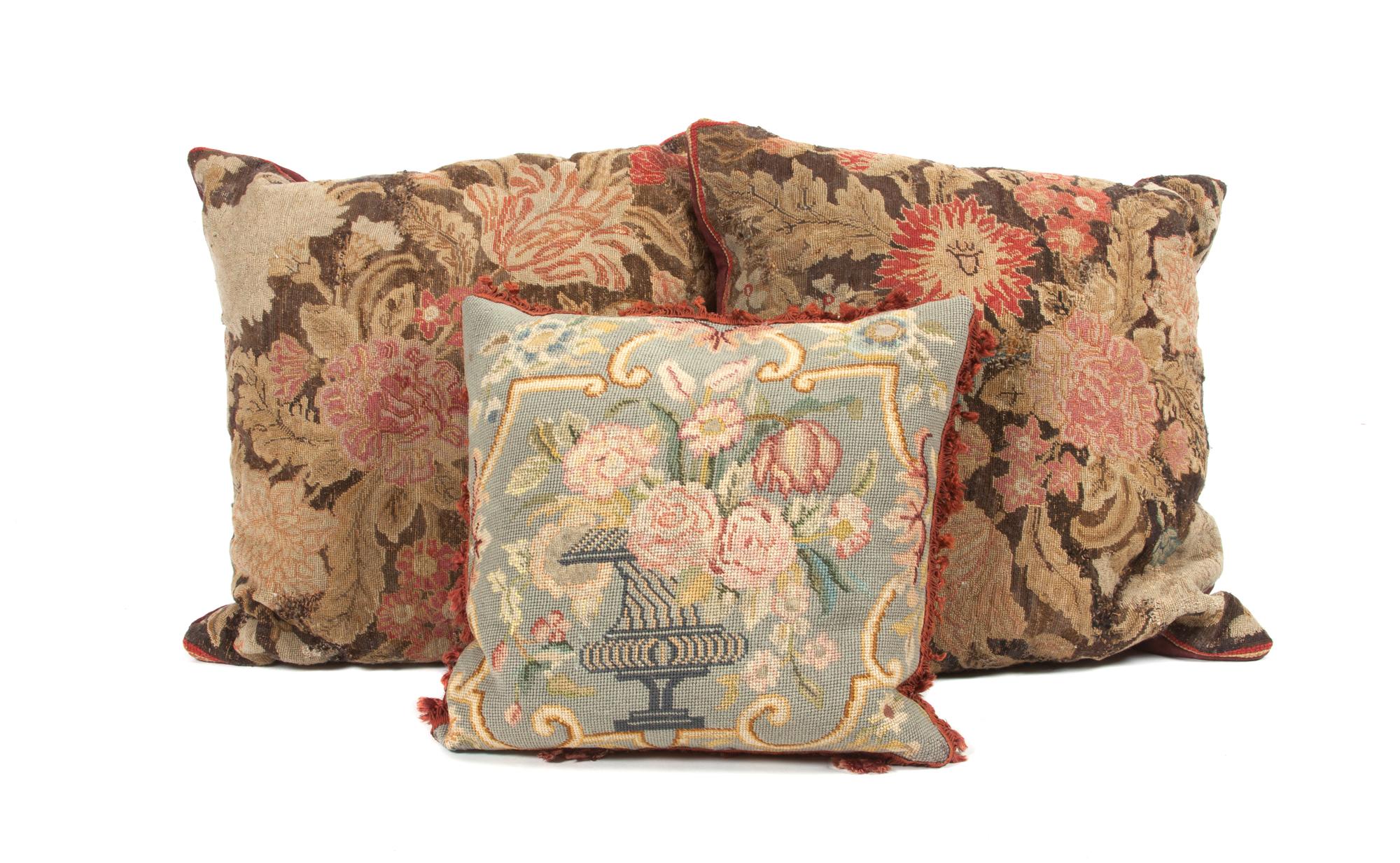 A Collection of Three Needlepoint Pillows Height of largest 19 inches.
