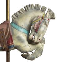 A Carved and Polychrome Painted Jumper Carousel Horse
