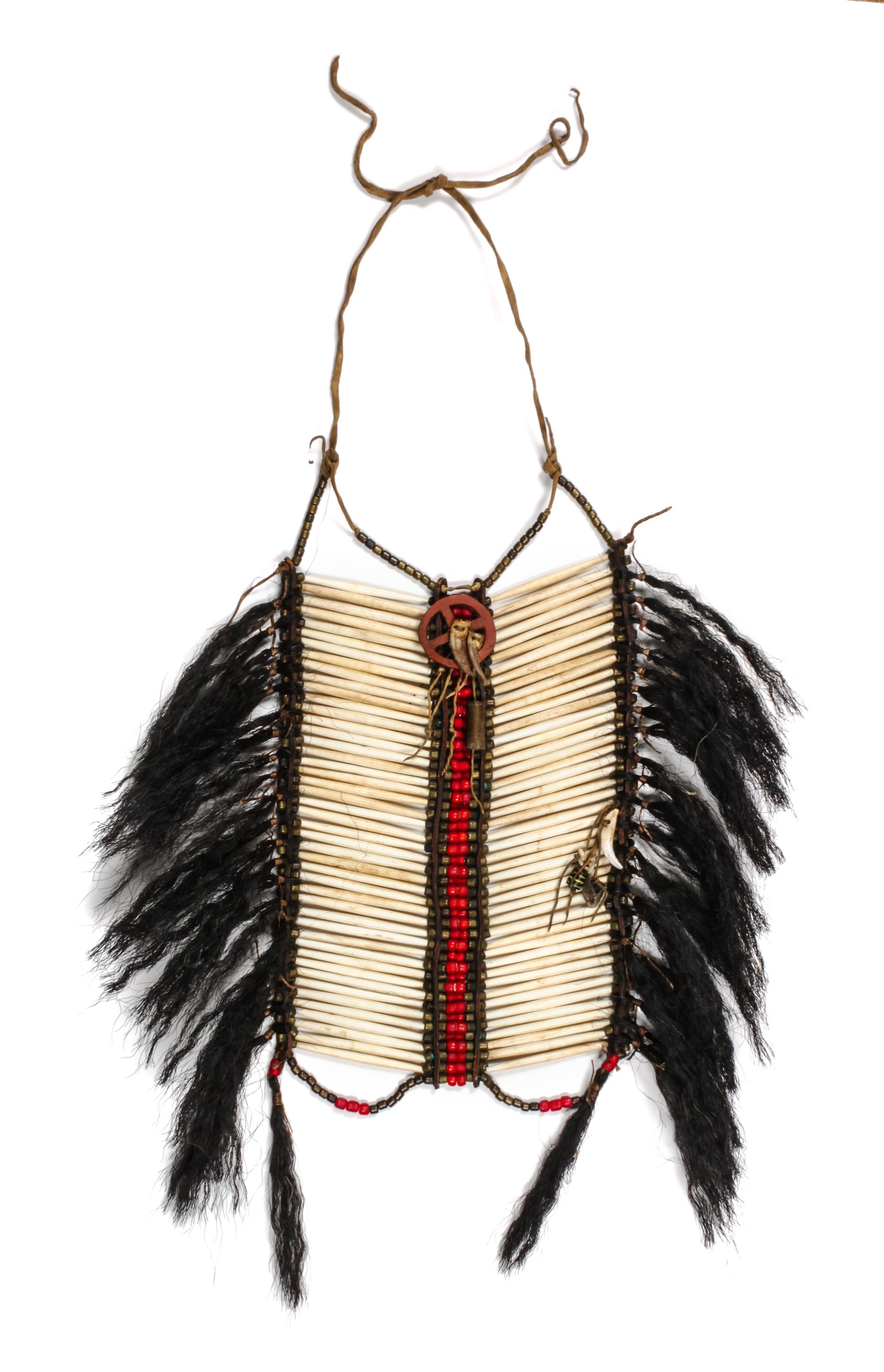 A Plains Style Breastplate Height approximately 14 x width without fringe 9 inches. — 20TH CENTURY