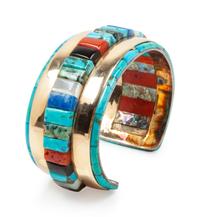 Yellow gold cuff bracelet with turquoise, coral, jet, shell, and lapis mosaic inlay