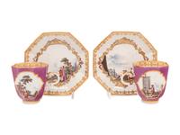 A Pair of Meissen Magenta-Ground Scenic Porcelain Teacups and Saucers