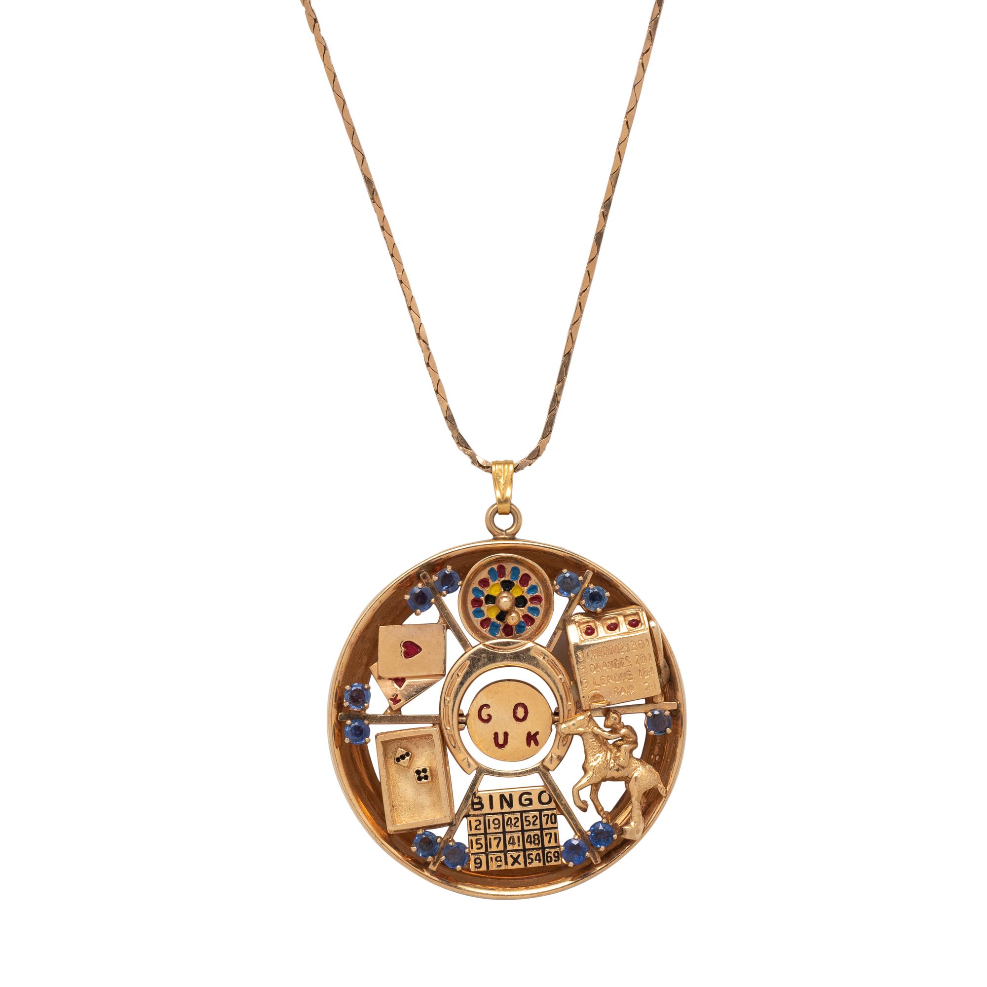 RETRO, YELLOW GOLD, SAPPHIRE AND ENAMEL 'GOOD LUCK' PENDANT/NECKLACE