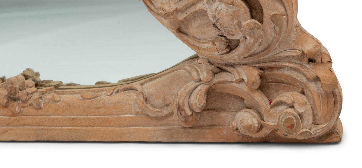 A German Rococo Style Limed Wood Overmantel Mirror