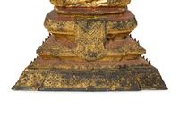 A Cambodian Red Lacquer and Parcel Gilt Figure of Seated Deity