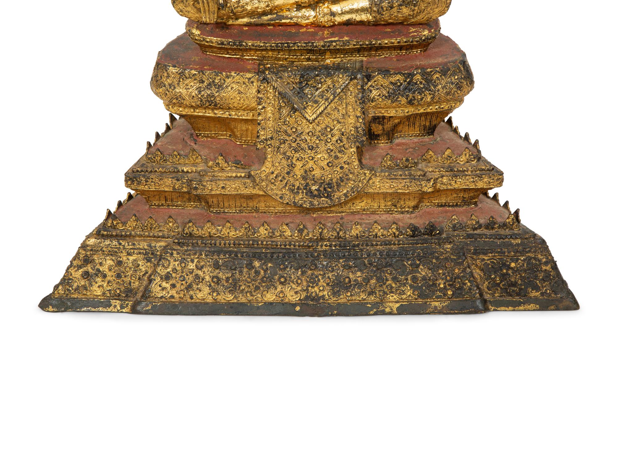 A Cambodian Red Lacquer and Parcel Gilt Figure of Seated Deity