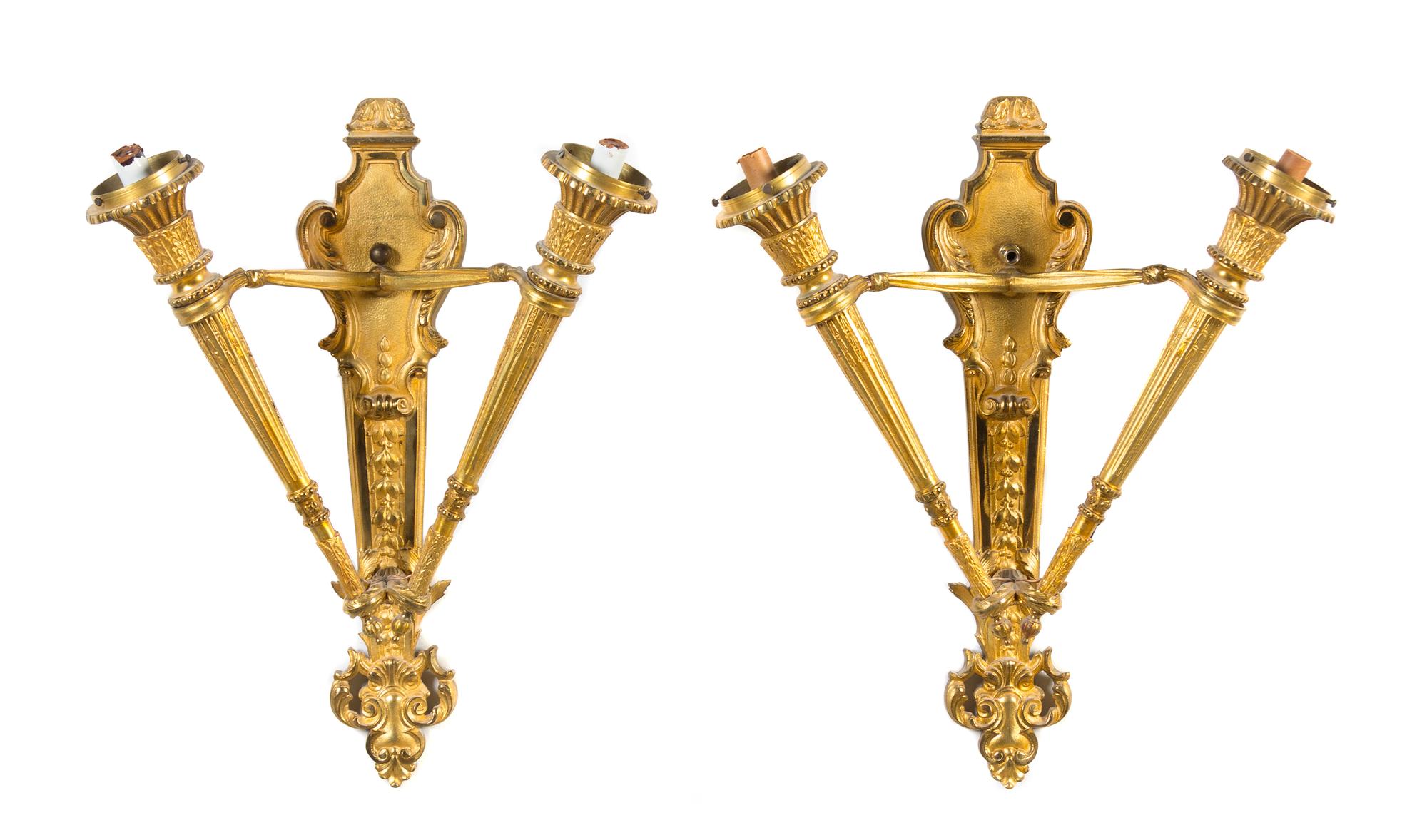 A Pair of Continental Gilt Bronze Two-Light Sconces Height 23 inches.