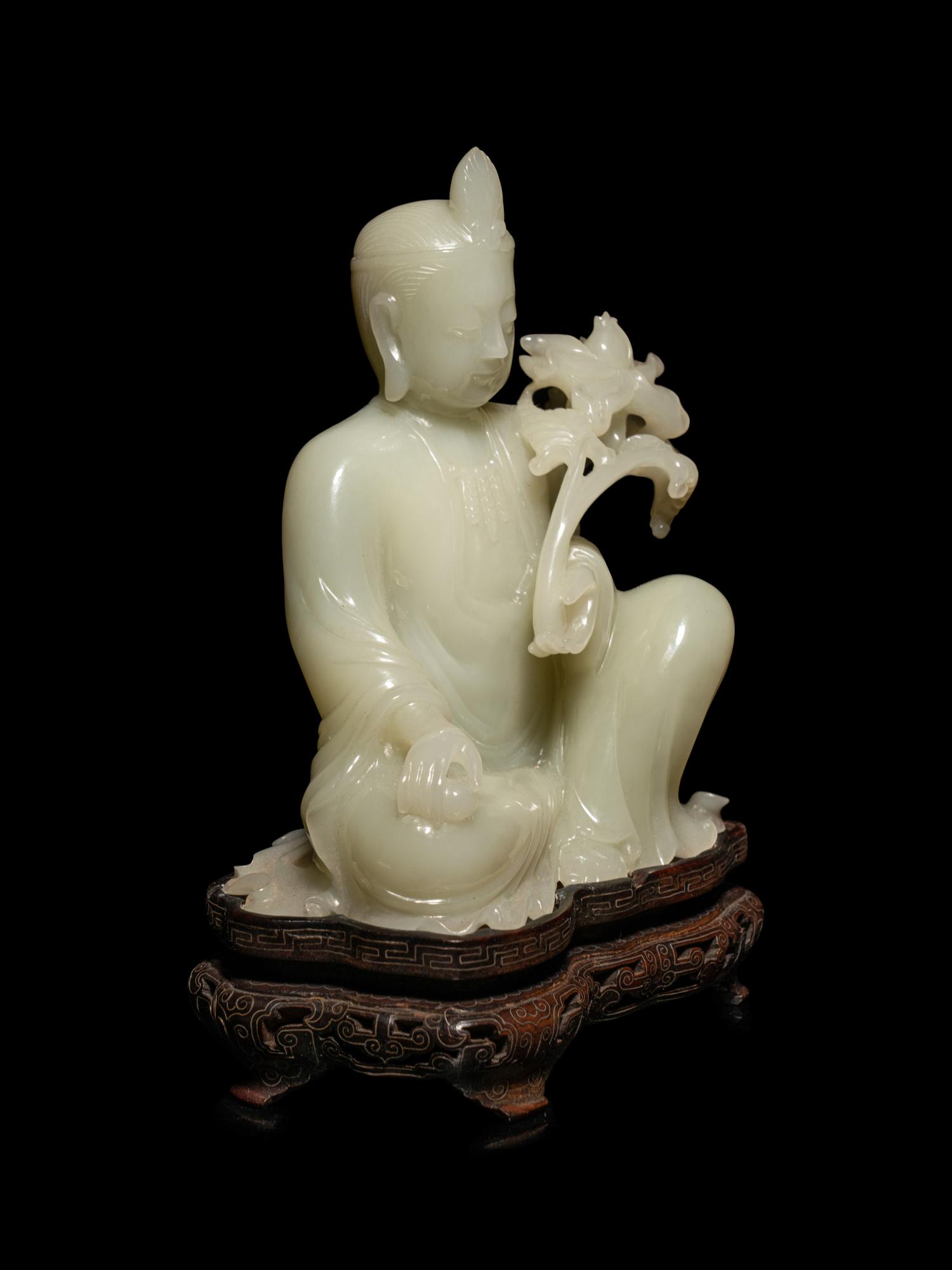 A Pale Celadon Jade Figure of Guanyin