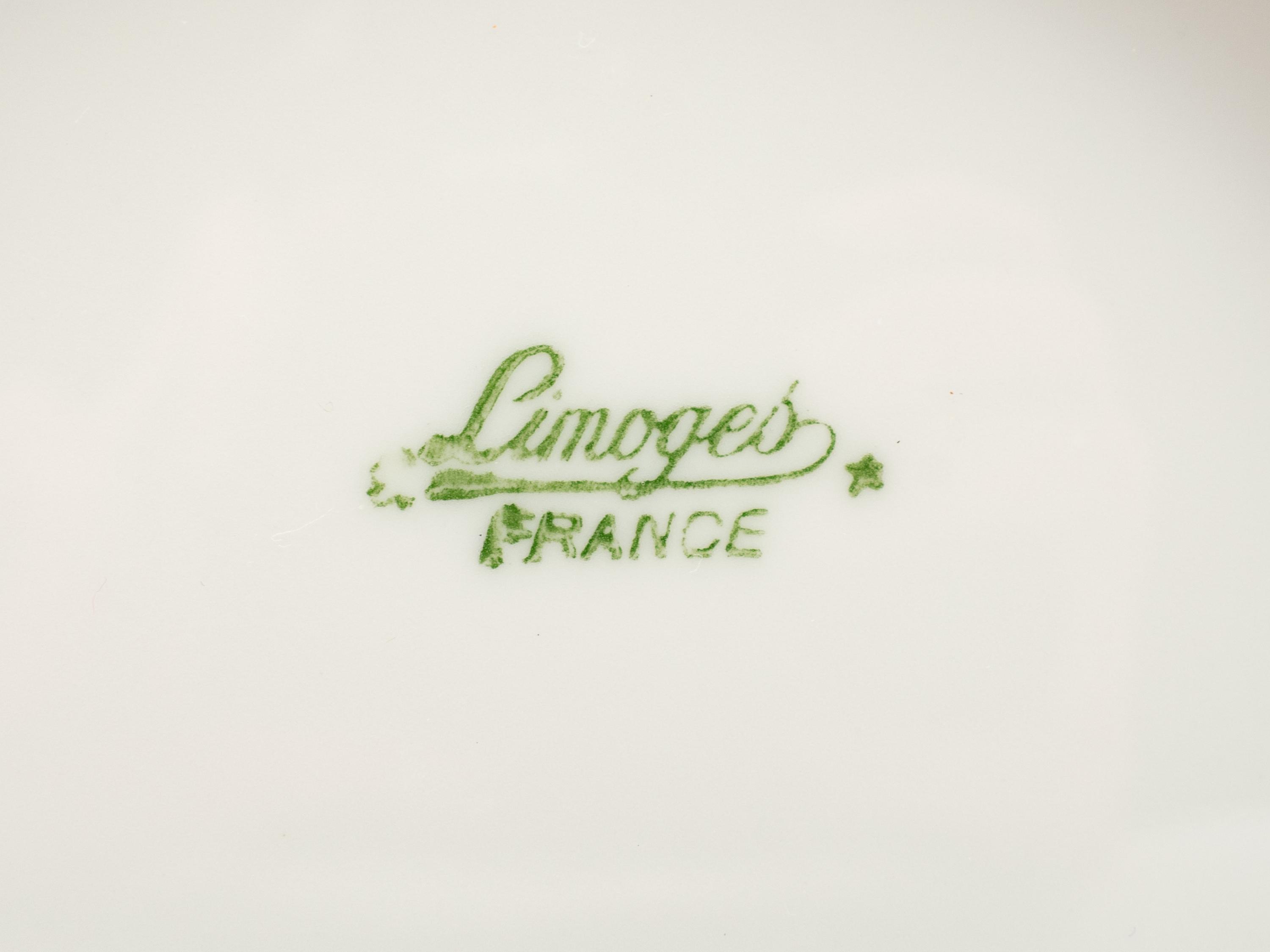 A Set of Four Limoges Porcelain Cache Pots