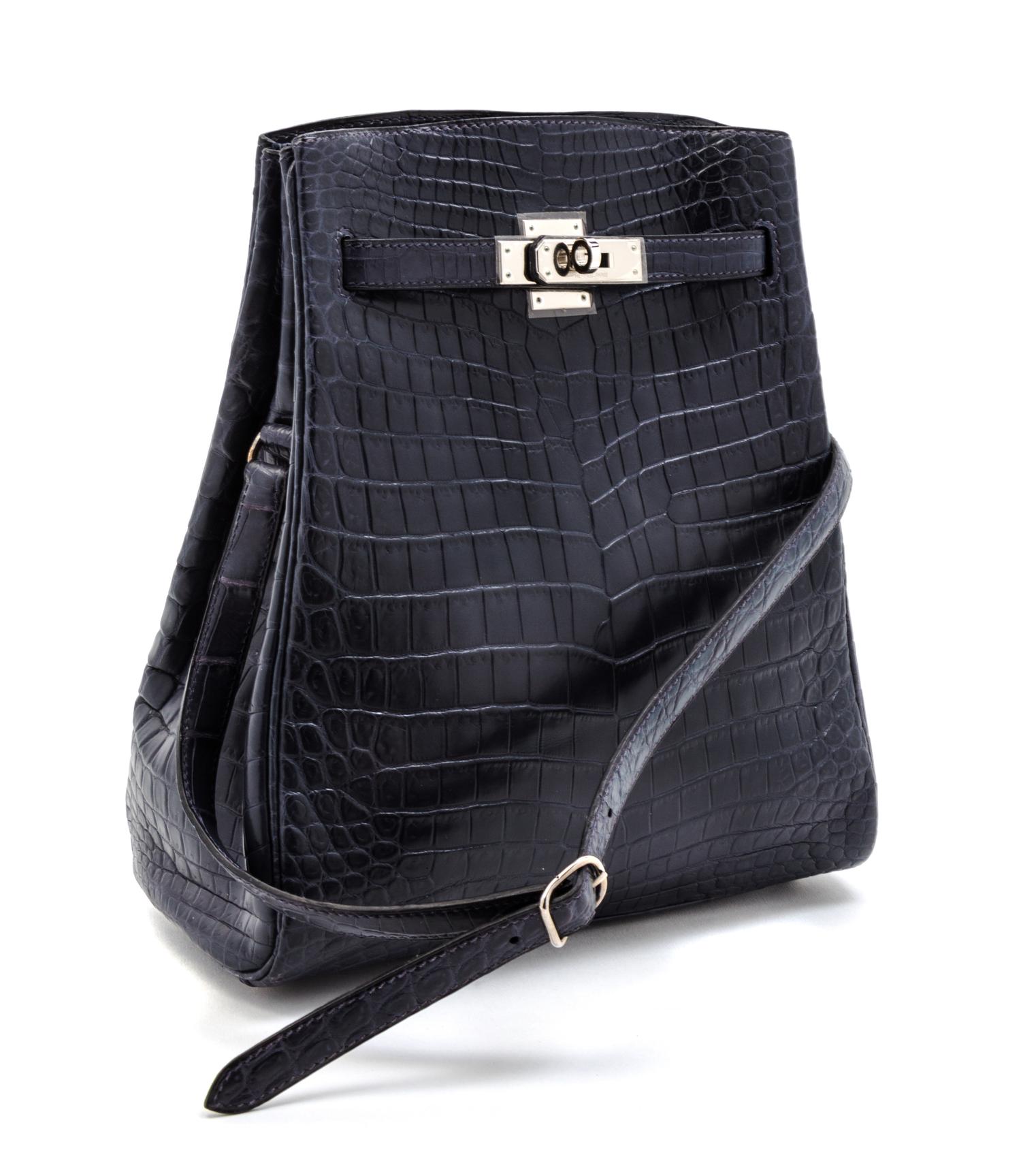 An Hermes 25cm Navy Niloticus Crocodile Kelly Sport Bag, 11 x 9 1/2 x 4 1/2 inches.