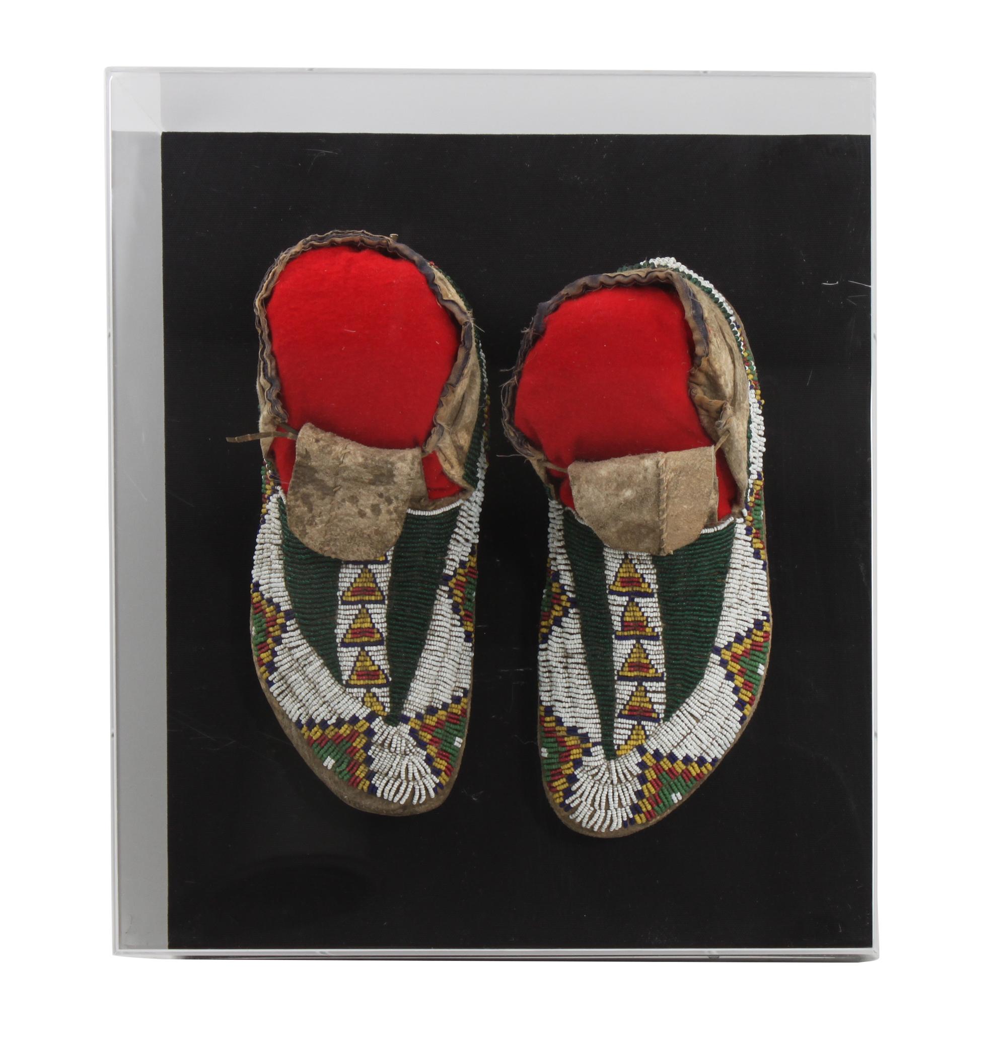 A Pair of Sioux Mocassins Length 11 inches — CIRCA 1900