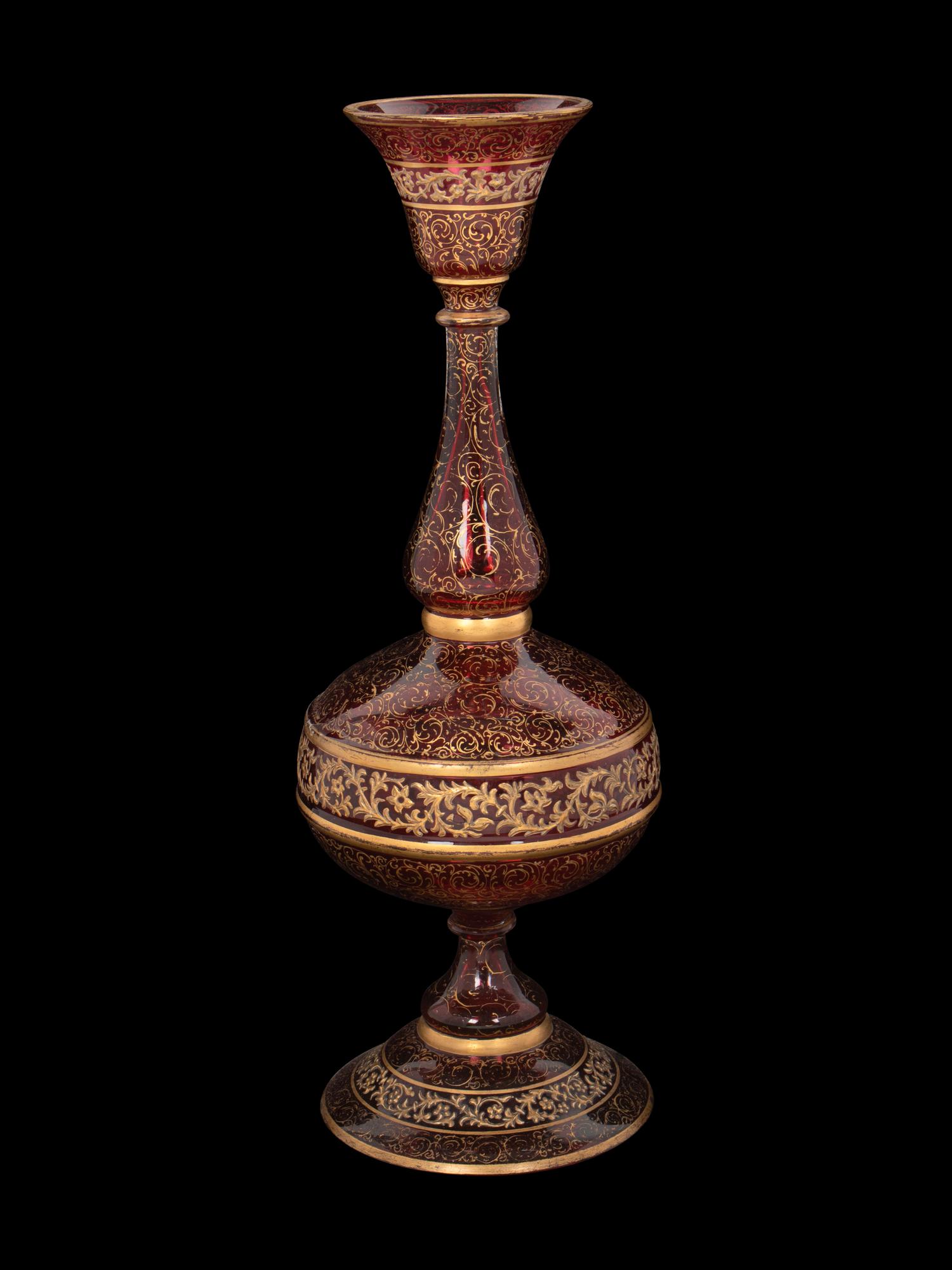 A Persian Market Gilt Decorated Cranberry Glass Vase