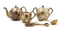 A Russian Gilded Silver Tea Service, Ovchinnikov, Height of tallest 4 1/2 inches.