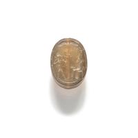 A Phoenician Carnelian Scaraboid with a Seated King and Hero