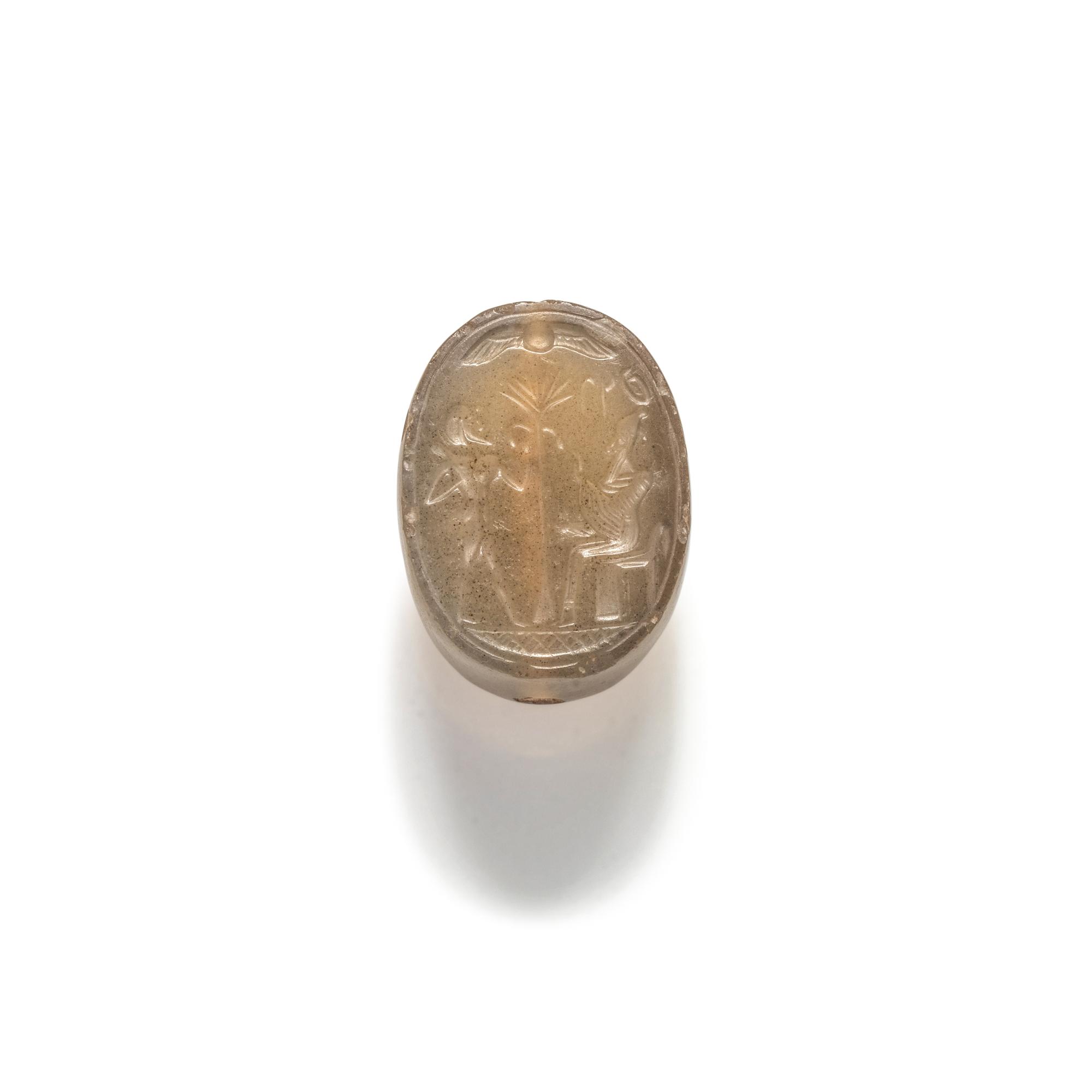 A Phoenician Carnelian Scaraboid with a Seated King and Hero