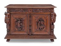 A Swiss Black Forest Carved Hunt Cabinet