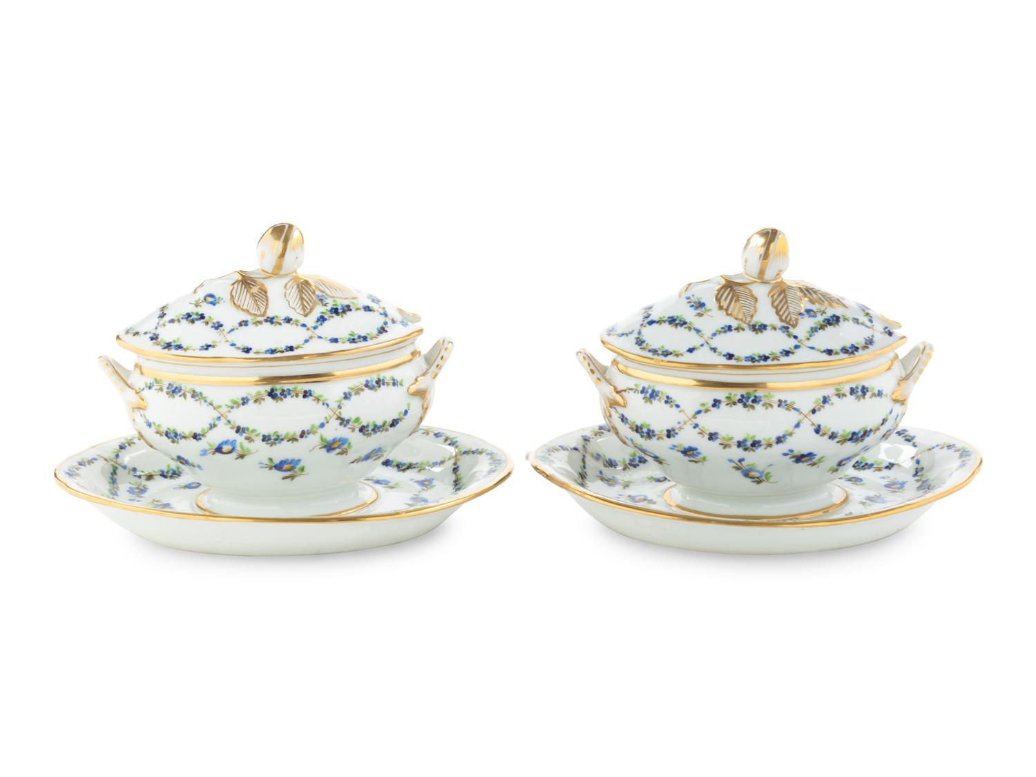 A Pair of English Porcelain Covered Sauce Tureens with Attached Underplates
