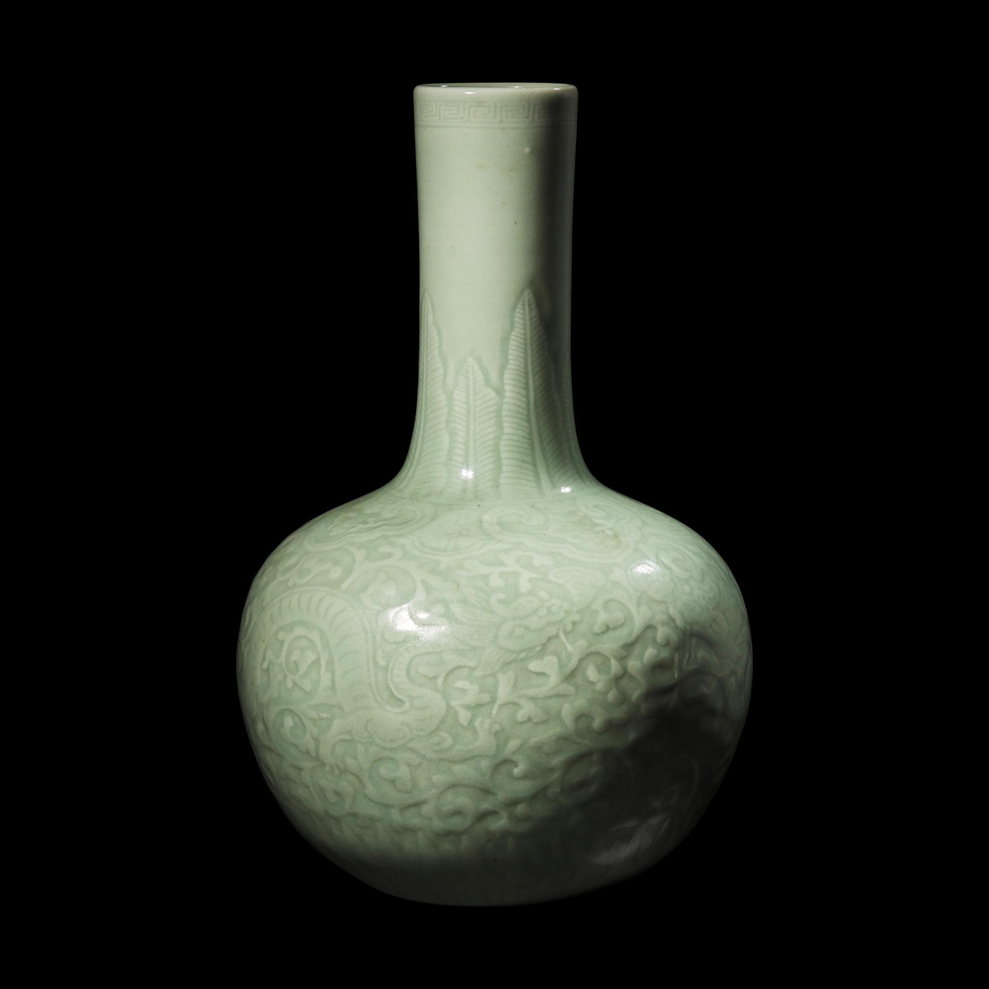 A Chinese Celadon Glazed Molded Porcelain Bottle Vase, Late Qing Dynasty 清晚期 粉青釉龍紋天球瓶