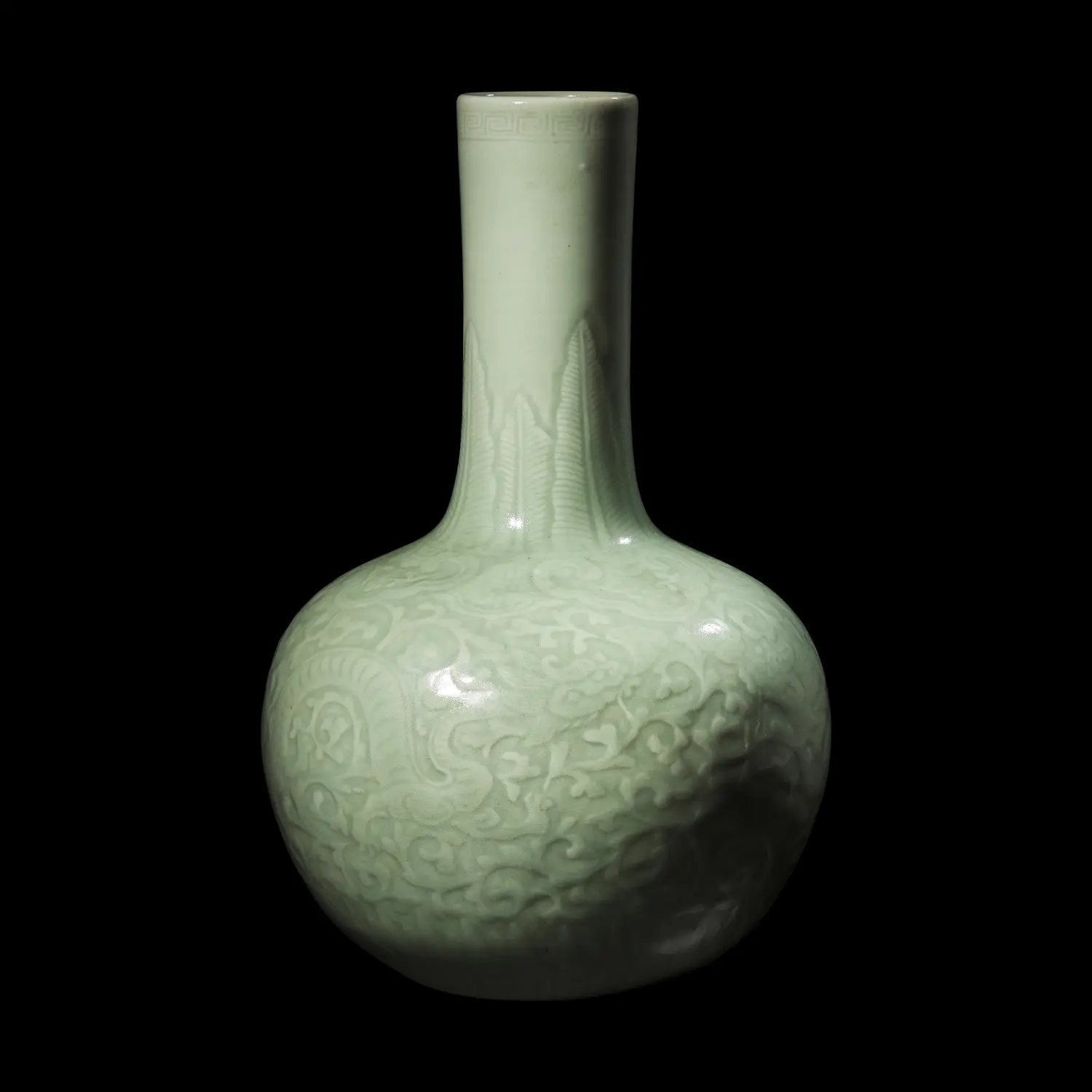 A Chinese Celadon Glazed Molded Porcelain Bottle Vase, | Freeman's